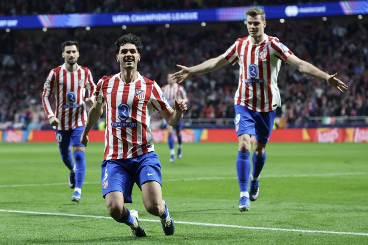 Atletico Madrid's US midfielder #05 Johnny Cardoso (C) celebrates scoring his team's second goal during the UEFA Champions League knockout round play-off second leg football match between Club Atletico de Madrid and Club Brugge KV at Metropolitano Stadium in Madrid on February 24, 2026. Pierre-Philippe MARCOU / AFP