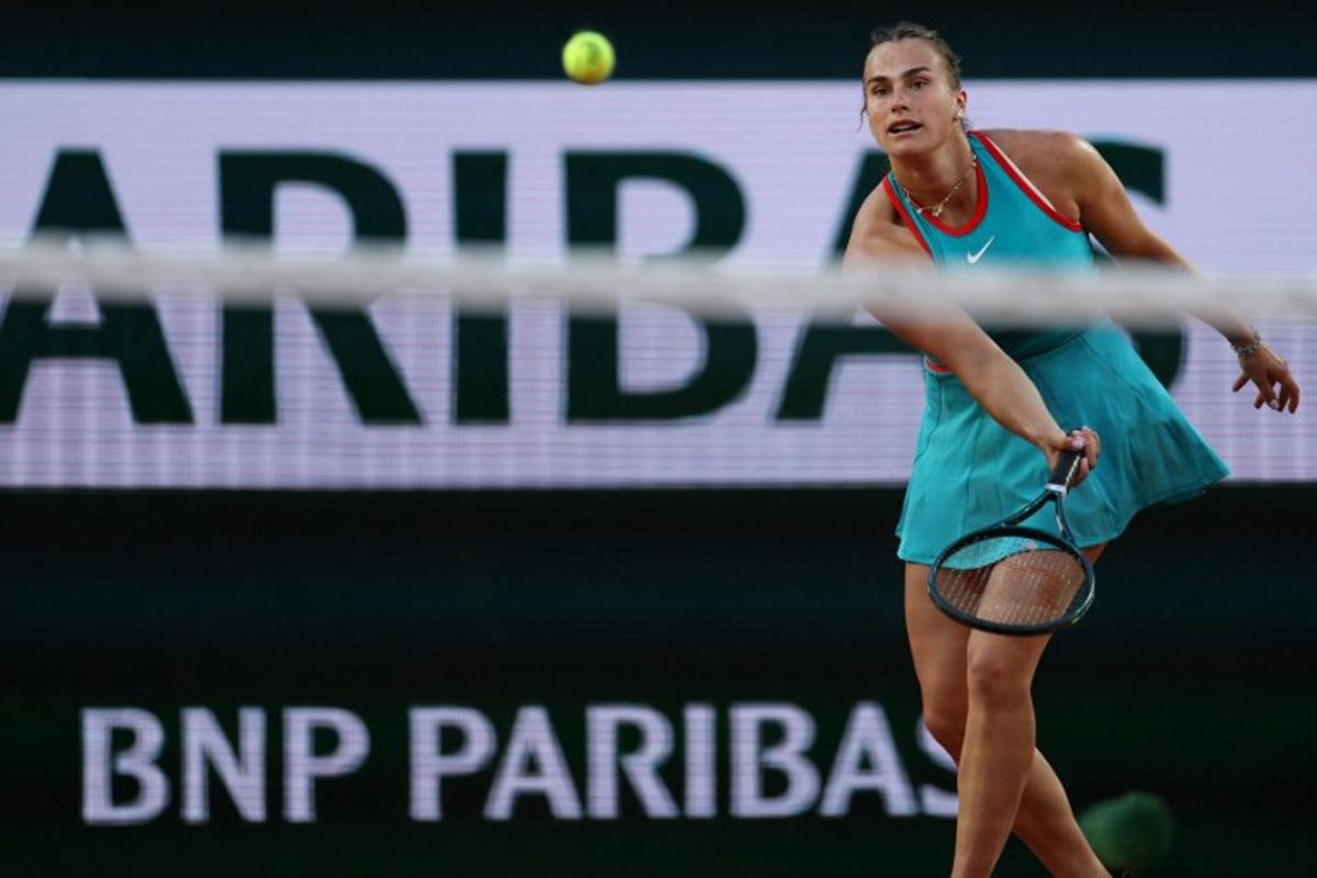 Belarus' Aryna Sabalenka plays a forehand return to Switzerland's Jil Teichmann during their women's singles match on day 4 of the French Open tennis tournament on Court Suzanne-Lenglen at the Roland-Garros Complex in Paris on May 28, 2025. ALAIN JOCARD / AFP