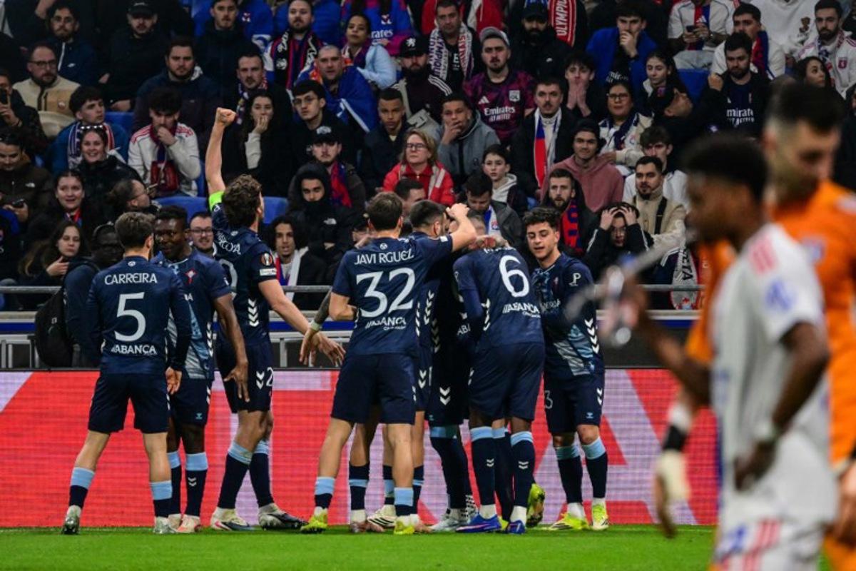 Celta Vigo's players celebrates after Javi Rueda scored a goal during the UEFA Europa League last 16 second leg football match between Olympique Lyonnais (OL) and Celta Vigo at the Groupama Stadium in Lyon, central-eastern France, on March 19, 2026. OLIVIER CHASSIGNOLE / AFP