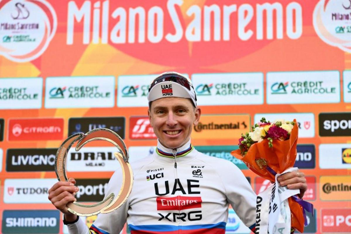 UAE Team Emirate's Slovenian rider Tadej Pogacar, winner, poses on the podium of the 117th Milan - Sanremo one-day classic cycling race, in Sanremo on March 21, 2026. Marco BERTORELLO / AFP