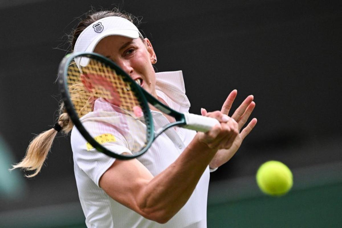 Russia's Ekaterina Alexandrova plays a forehand return to Switzerland's Belinda Bencic during their women's singles fourth round tennis match on the eighth day of the 2025 Wimbledon Championships at The All England Lawn Tennis and Croquet Club in Wimbledon, southwest London, on July 7, 2025. Kirill KUDRYAVTSEV / AFP