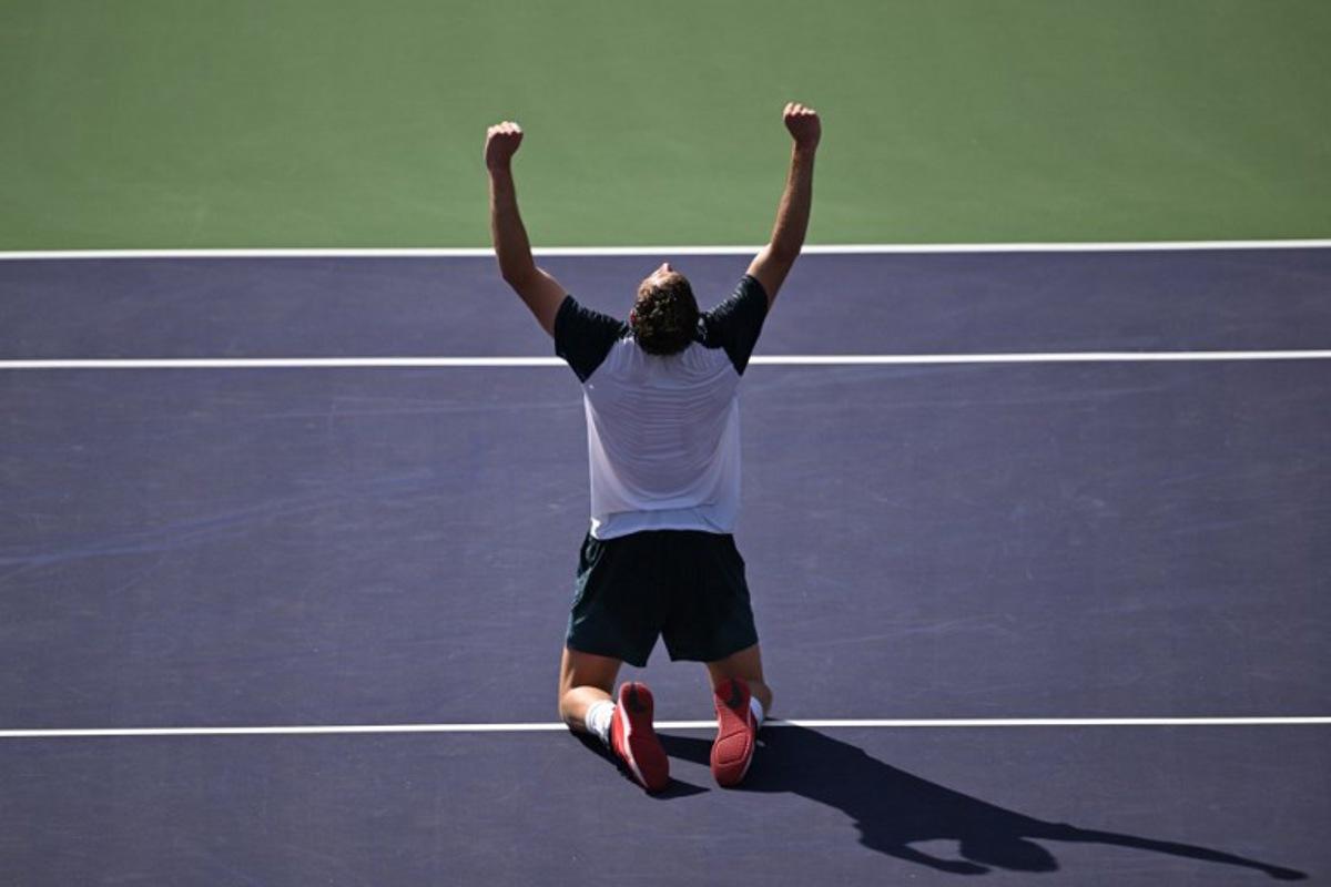 Britain's Jack Draper celebrates after defeating Denmark's Holger Rune during the men's singles final tennis match at the BNP Paribas Open at the Indian Wells Tennis Garden in Indian Wells, California, on March 16, 2025. Patrick T. Fallon / AFP
