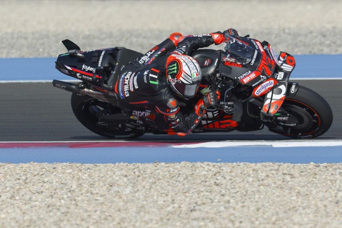 Aprilia Racing's Italian rider Marco Bezzecchi drives during the second free practice session of the Qatar MotoGP Grand Prix at the Lusail International Circuit in Lusail, north of Doha, on April 12, 2025. Karim JAAFAR / AFP