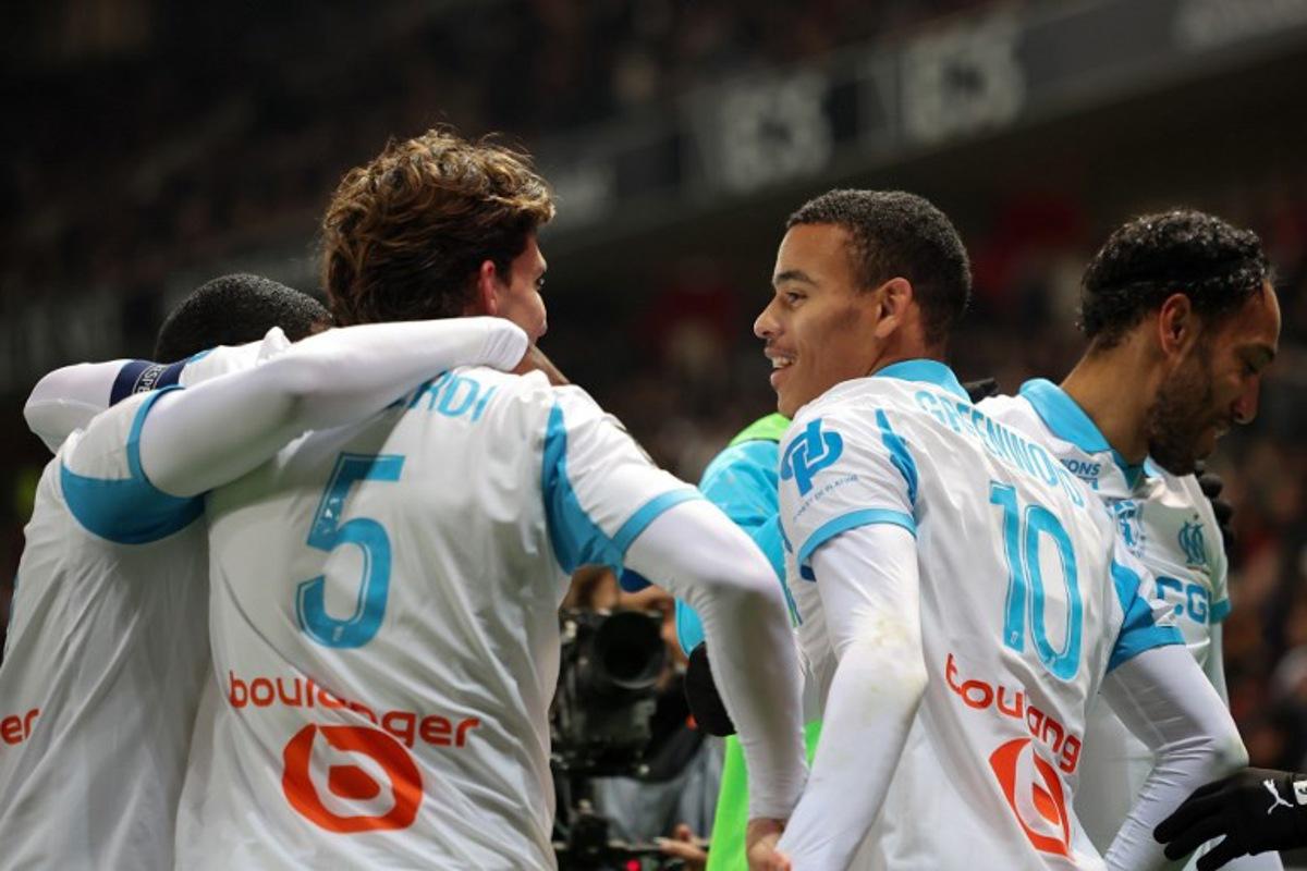 Marseille's English forward #10 Mason Greenwood (2nd, R) celebrates scoring his team's third goal with teammates during the French L1 football match between OGC Nice and Olympique de Marseille (OM) at the Allianz Riviera stadium in Nice, south-eastern France, on November 21, 2025. Valery HACHE / AFP