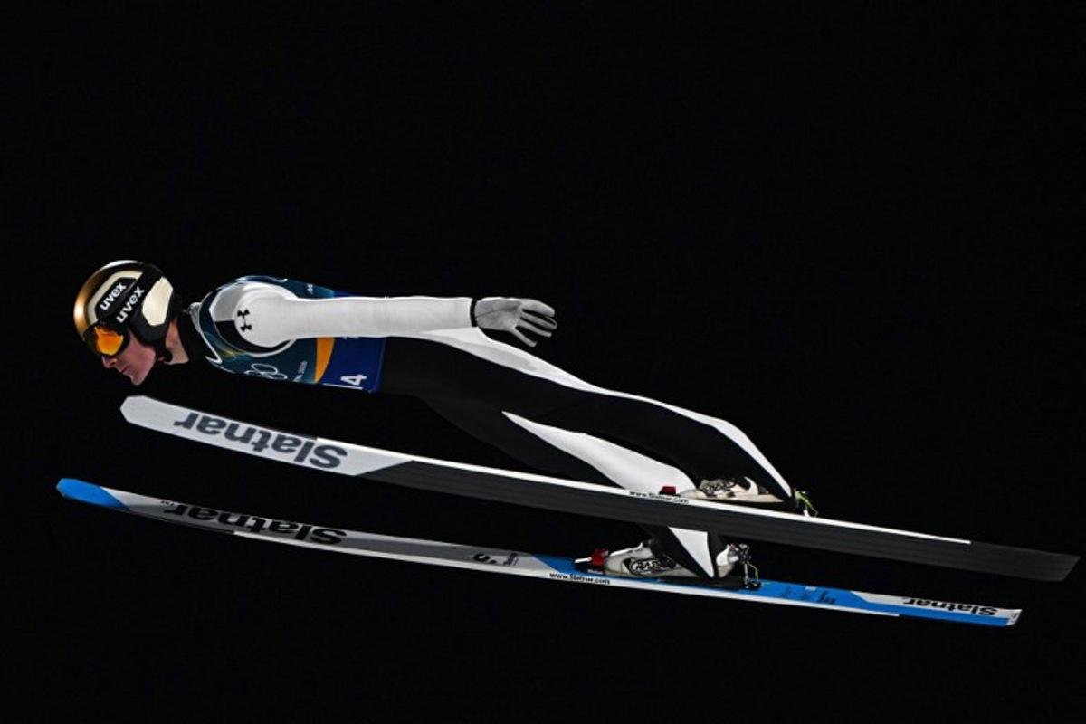 Slovenia's Domen Prevc jumps during the ski jumping mixed team 1st round of the Milano Cortina 2026 Winter Olympic Games at Predazzo Ski Jumping Stadium in Predazzo (Val di Fiemme), on February 10, 2026. Javier SORIANO / AFP