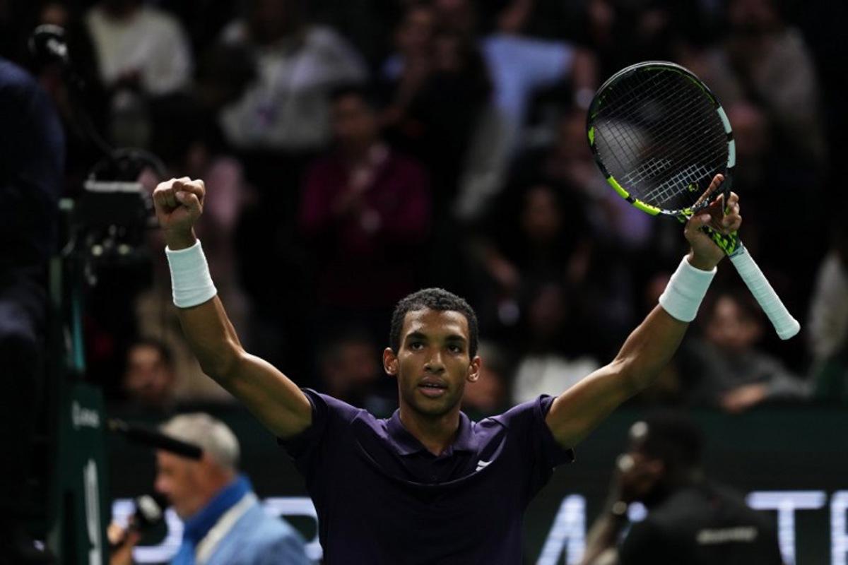 Canada's Felix Auger-Aliassime celebrates after winning against Monaco's Valentin Vacherot following their men's singles quarter-final match on day five of the Paris ATP Masters 1000 tennis tournament at the Paris La Défense Arena in Nanterre, on the outskirts of Paris, on October 31, 2025. Dimitar DILKOFF / AFP