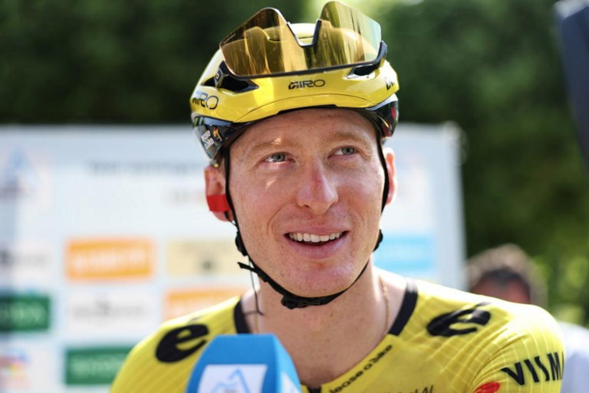 Team Visma | Lease a Bike's US rider Matteo Jorgenson looks on before the start of the 1st stage of the Tour Auvergne-Rhone-Alpes cycling race (formerly known as the Criterium du Dauphine), 146,2km between Vizille and Saint-Ismier, in the French Alps, on June 7, 2026. Anne-Christine POUJOULAT / AFP