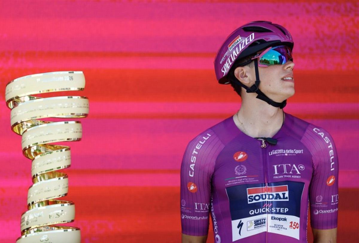 Soudal Quick-Step French rider Paul Magnier wearing the points classification mauve jersey (Maglia Ciclamino) looks on during the presentation of the teams prior the 3nd stage of the Giro d'Italia 2026 - Tour of Italy cycling race between Plovdiv and Sofia, Bulgaria, on May 10, 2026. Luca Bettini / AFP