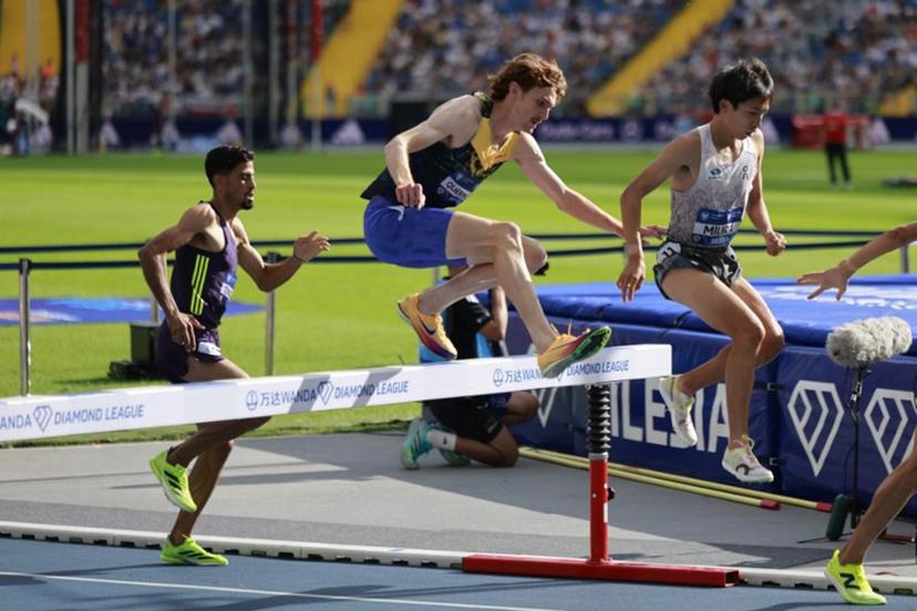 Japan's Ryuji Miura (R), Luxembourg's Ruben Querinjean (C) and Marocco's Mohamed Tindouft (L) compete in the 3000 m Steeple Chase competition of the Silesia Diamond League athletics meeting in Katowice, Poland, on August 23, 2026. Wojtek RADWANSKI / AFP