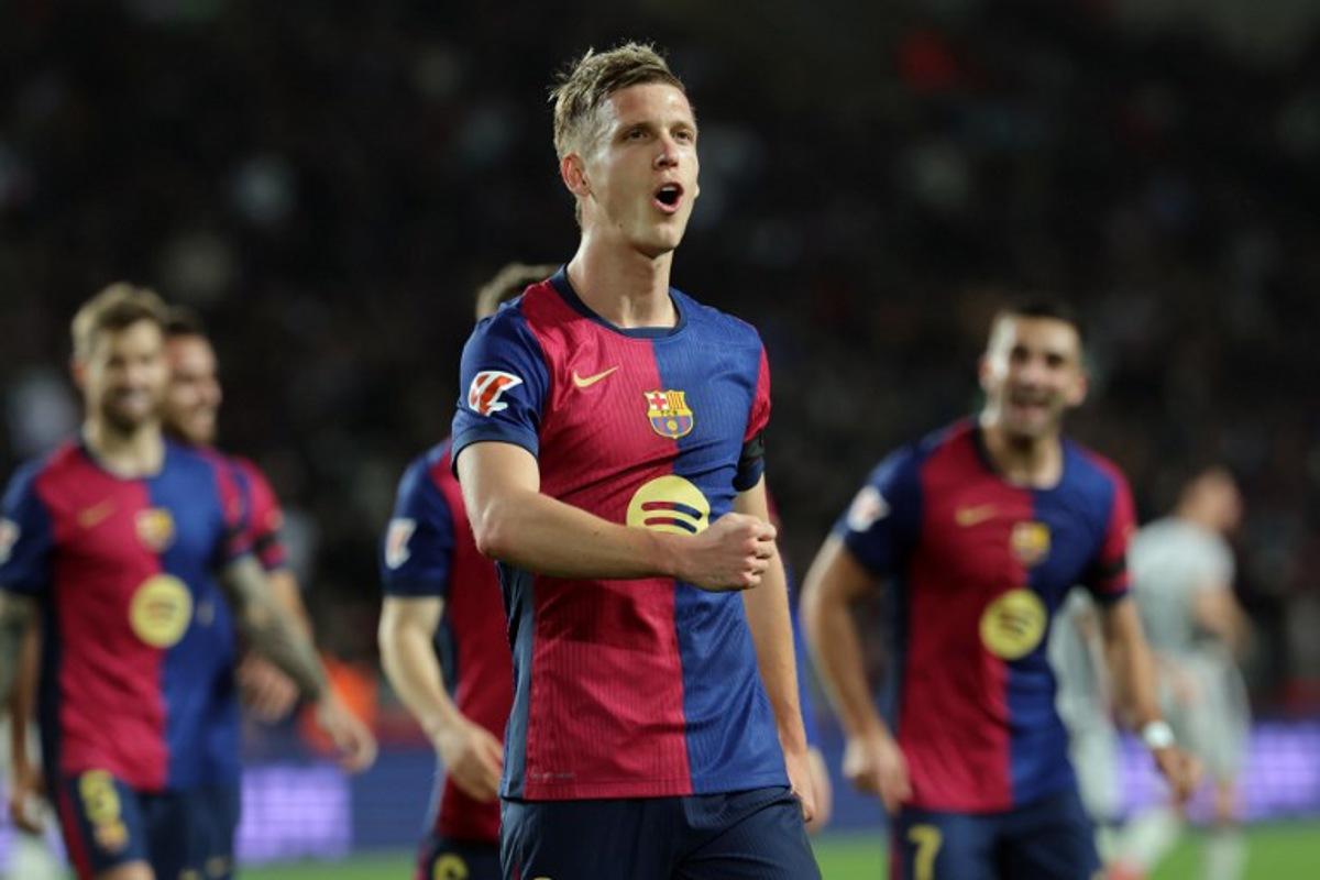 Barcelona's Spanish forward #20 Daniel Olmo celebrates after scoring a penalty kick and his team's second goal during the Spanish league football match between FC Barcelona and CA Osasuna at Estadi Olimpic Lluis Companys in Barcelona on March 27, 2025. LLUIS GENE / AFP