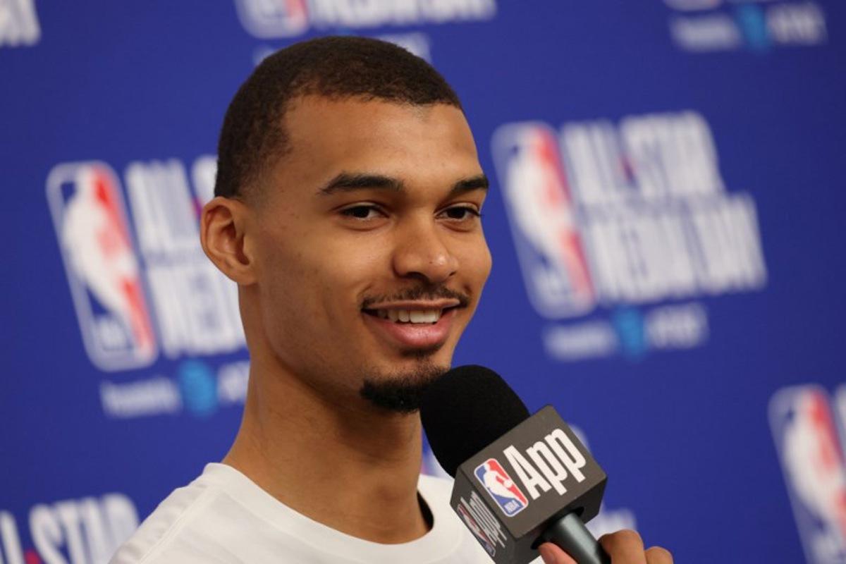French basketball player Victor Wembanyama of the San Antonio Spurs speaks to the media during the NBA All-Star media day at the Intuit Dome in Inglewood, California, on February 14, 2026. Patrick T. Fallon / AFP