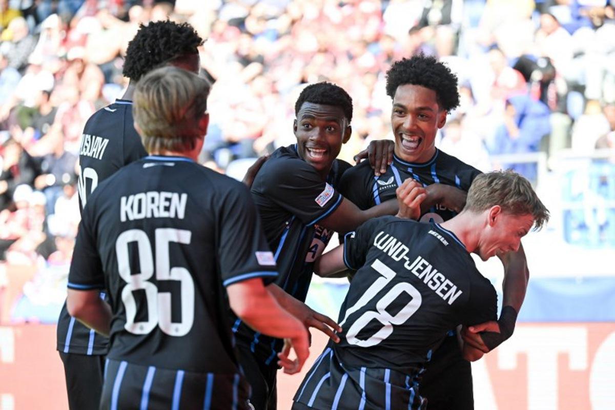 Club Brugge's English defender #90 Andre Garcia (up R) celebrates after scoring his team's second goal during the UEFA Youth League semi-final football match between Benfica and Club Brugge at Stade de la Tuiliere in Lausanne, on April 17, 2026. Fabrice COFFRINI / AFP