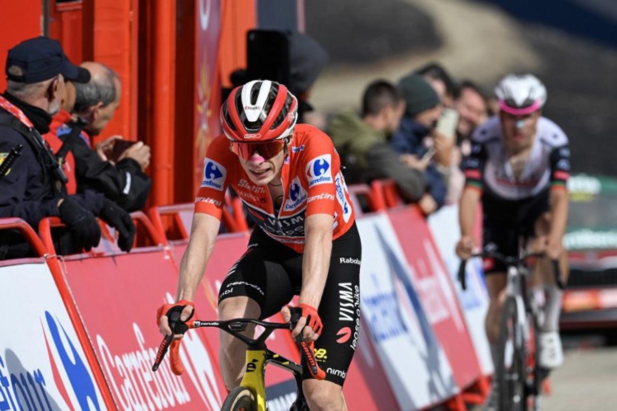 Overall race leader Team Visma-Lease a bike's Danish rider Jonas Vingegaard crosses the finish line of the 17th stage of the Vuelta a Espana, a 143 km race between O Barco de Valdeorras and Alto de El Morredero, Ponferrada, on September 10, 2025. Miguel RIOPA / AFP
