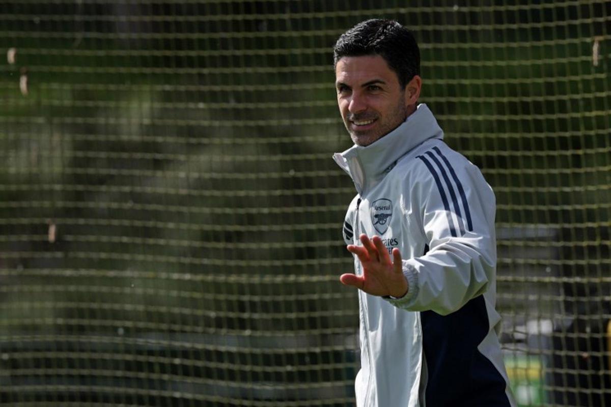 Arsenal's Spanish manager Mikel Arteta arrives to take a team training session at London Colney, north of London, on April 14, 2026, on the eve of their UEFA Champions League, quarter-final, second-leg football match against Sporting Lisbon. Adrian Dennis / AFP