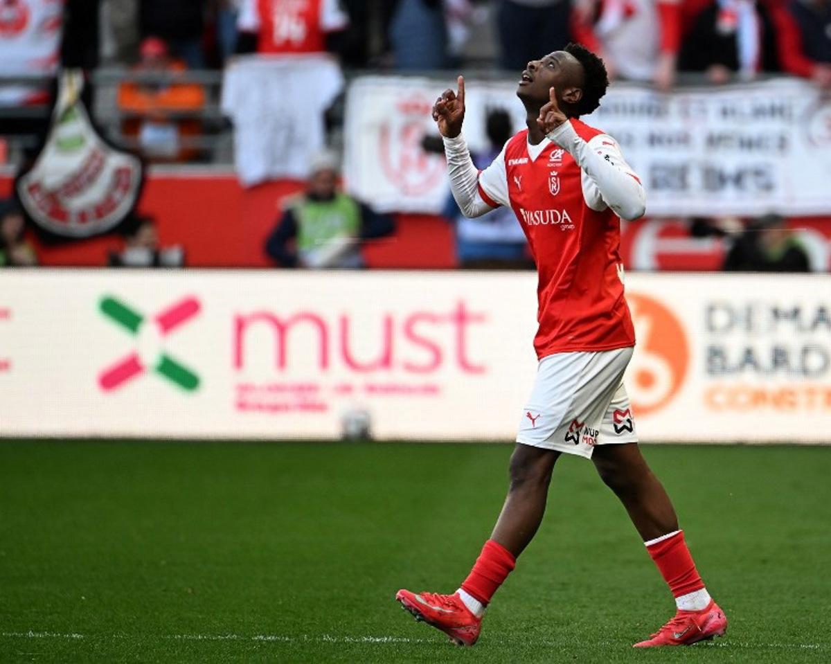 Reims' French forward #67 Mamadou Diakhon celebrates after scoring his team's second goal during the French L1 football match between Stade de Reims and Olympique de Marseille (OM) at Stade Auguste-Delaune in Reims, northern France on March 29, 2025. FRANCOIS NASCIMBENI / AFP
