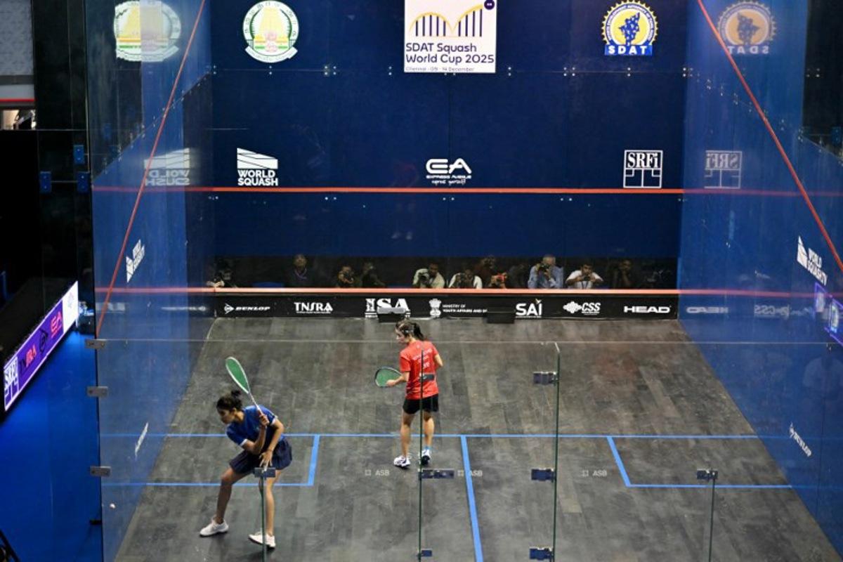 India's Joshna Chinappa (L) plays against Hong Kong, China's Ka Yi Lee during the finals match of the SDAT Squash World Cup held in Chennai on December 14, 2025. R. Satish BABU / AFP