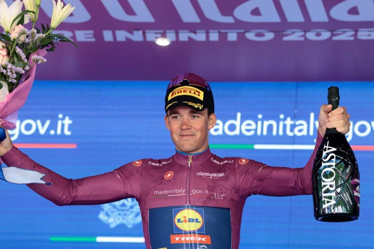 Lidl-Trek's Danish rider Mads Pedersen wearing the cyclamen jersey of best sprinter (Maglia Ciclamino) celebrates on the podium after the 19th stage of the 108th Giro d'Italia cycling race of 166kms from Biella to Champoluc on May 30, 2025. Luca Bettini / AFP
