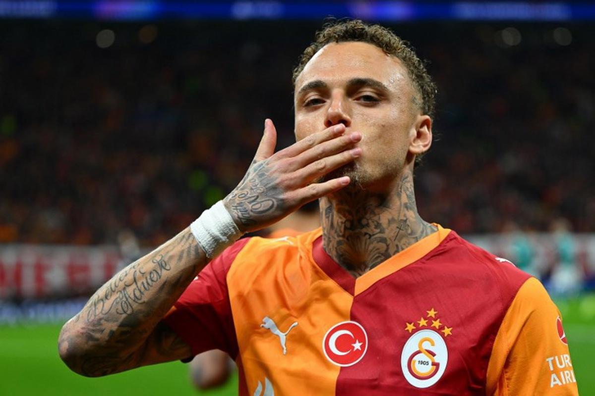 Galatasaray's Dutch forward #77 Noa Lang gestures during the UEFA Champions League round of 16 first leg football match between Galatasaray SK and Liverpool FC at the Ali Sami Yen Sports Complex in Istanbul on March 10, 2026. YASIN AKGUL / AFP