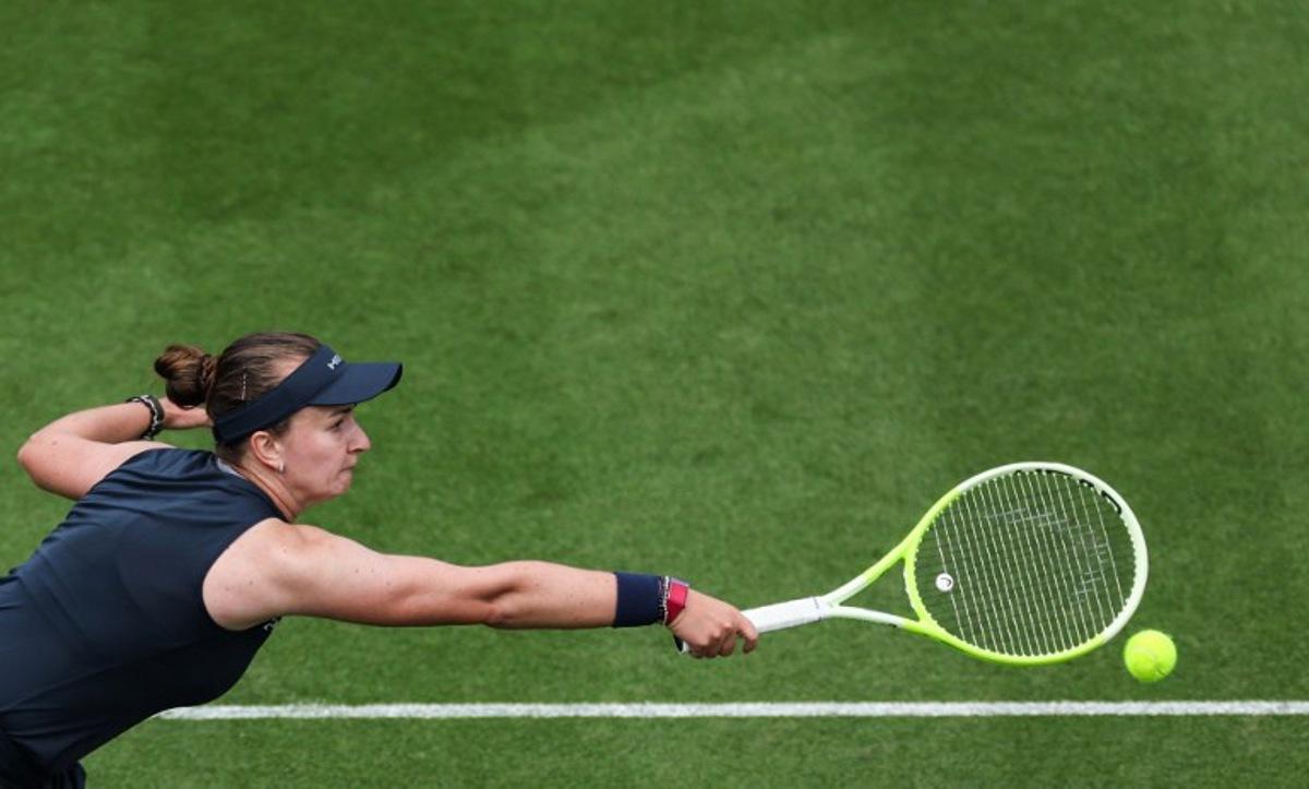 Czech Republic's Barbora Krejcikova plays a backhand return to Britain's Jodie Burrage during their women's singles round of 16 tennis match on day three at the Rothesay Eastbourne International tennis tournament in Eastbourne, southern England, on June 25, 2025. Adrian Dennis / AFP