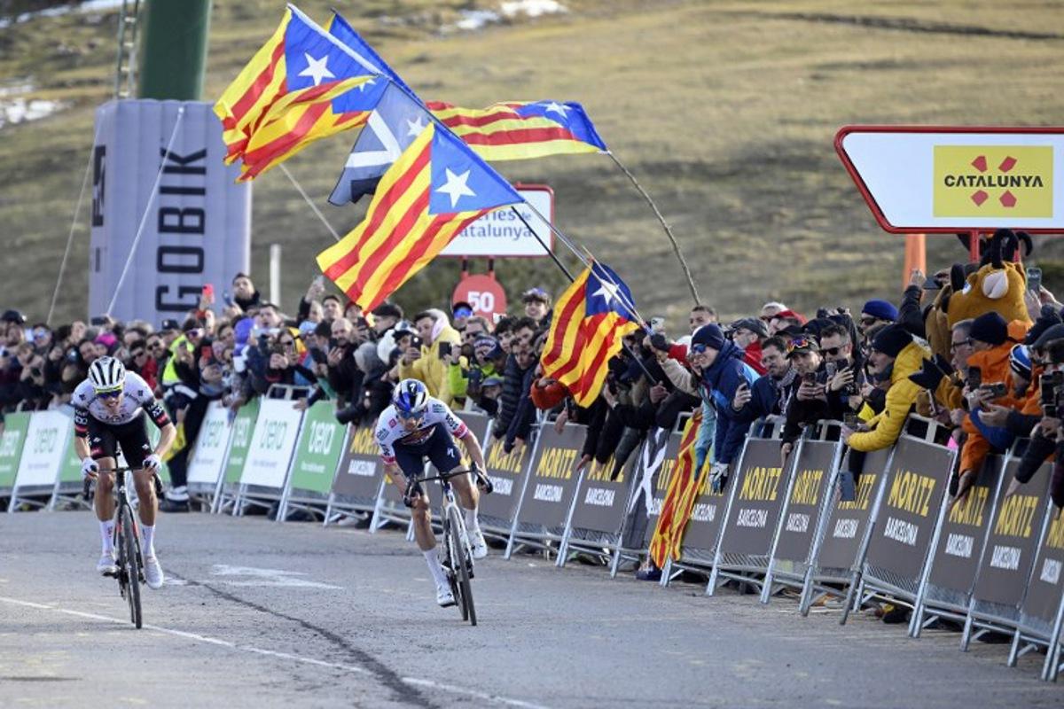 Team UAE's Juan Ayuso (L) and Team Bora's Primoz Roglic sprint to cross the finish line in first and second place respectively during the 3rd stage of the 2025 Volta a Catalunya cycling tour of Catalonia, a 178,3 km race between Viladecans and La Molina, on March 26, 2025. Josep LAGO / AFP