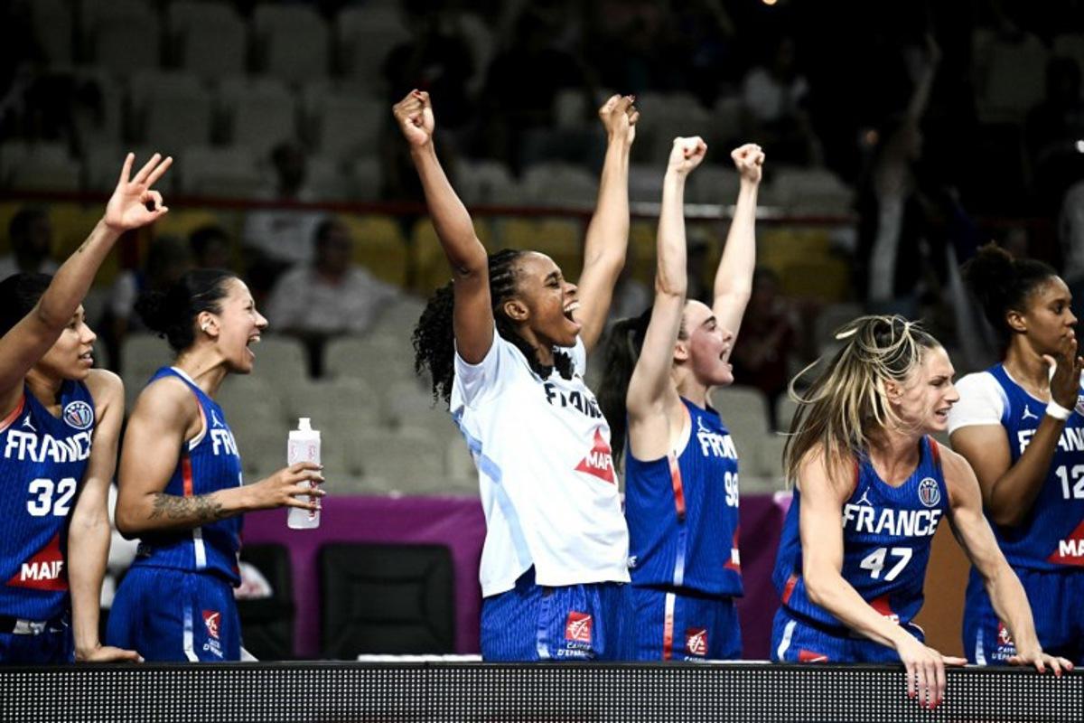 France's players celebrate after winning the FIBA Women's EuroBasket 2025 match between France and Turkey at the Peace and Friendship Stadium in Athens on June 18, 2025. Angelos Tzortzinis / AFP