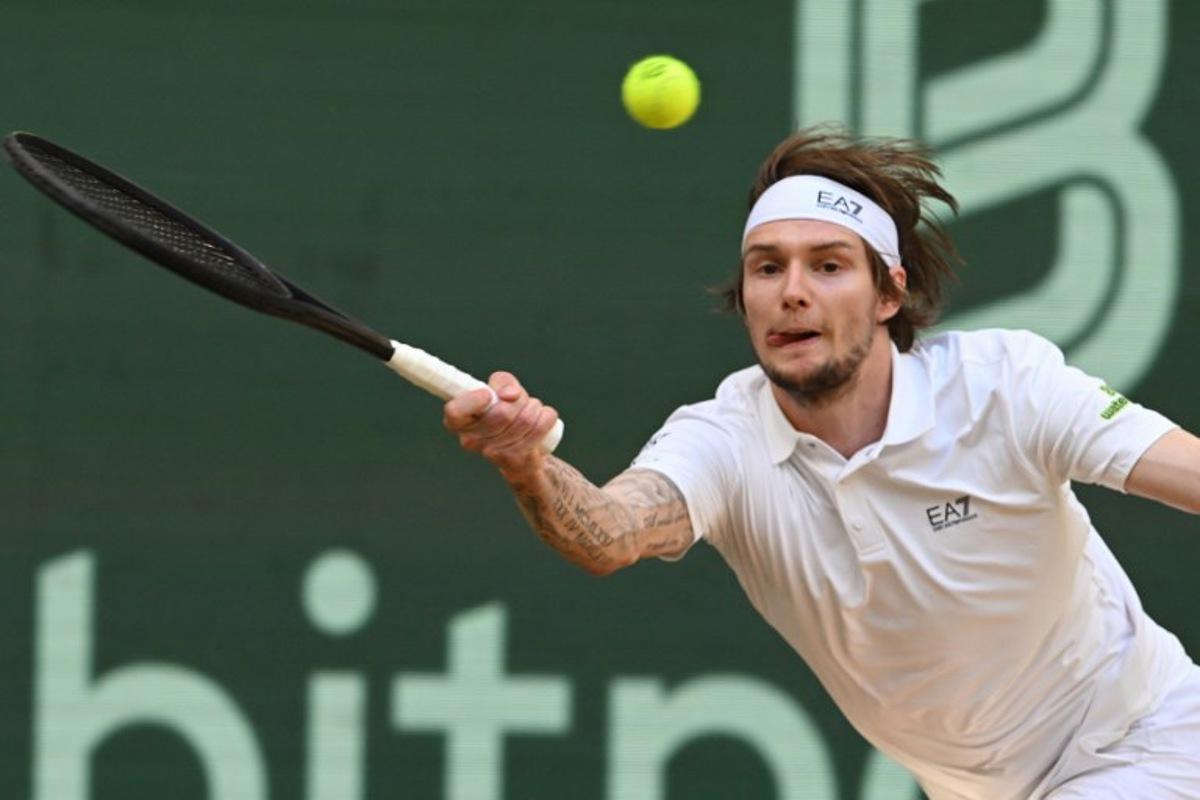 Kazakhstan's Alexander Bublik returns the ball to Russia's Karen Khachanov (not in picture) during the men's singles semi-final match at the Halle Open ATP tennis tournament in Halle, western Germany, on June 21, 2025. CARMEN JASPERSEN / AFP