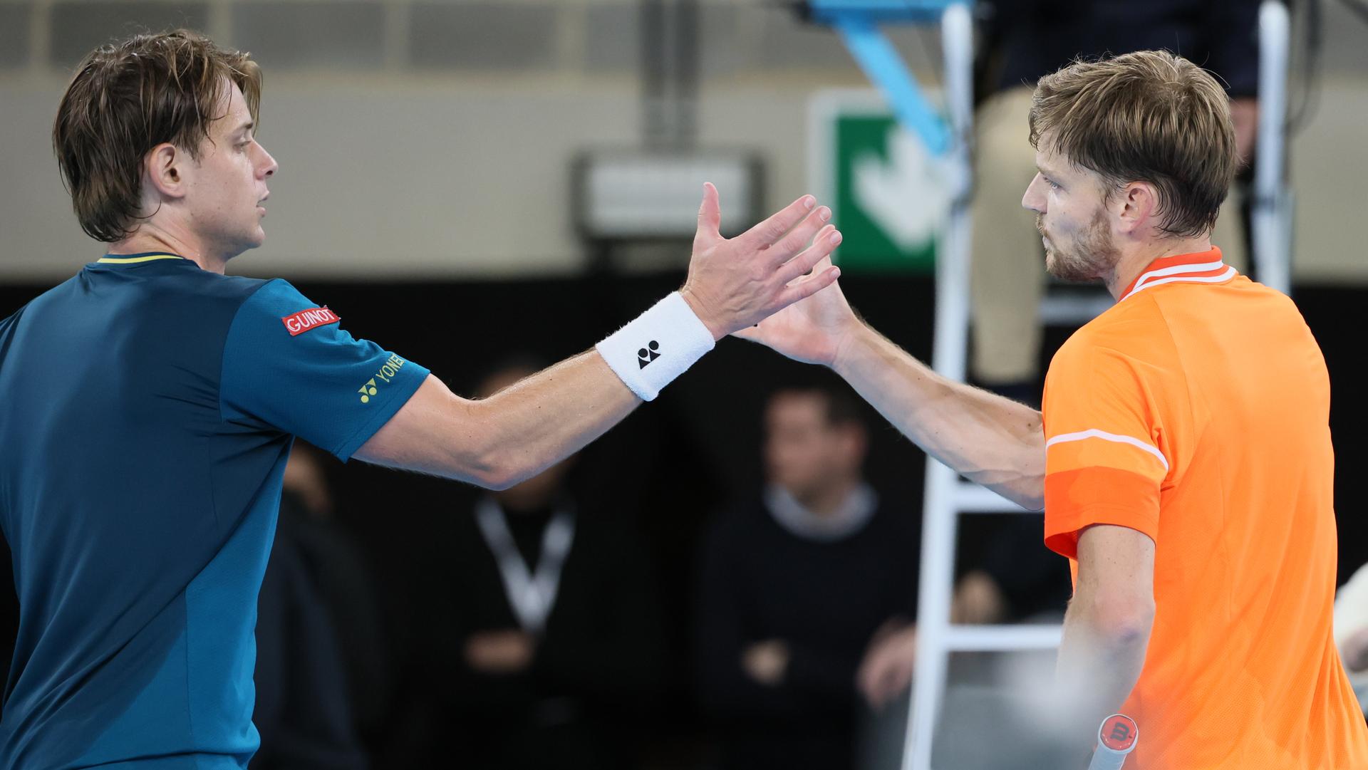 Belgian Zizou Bergs and Belgian David Goffin shake hands after their tennis match in the first round of the men's singles at the BW Open ATP Challenger 125 tournament, in Louvain-la-Neuve, Tuesday 23 January 2024. THE BW Open takes place from 22 to 28 January. BELGA PHOTO BENOIT DOPPAGNE