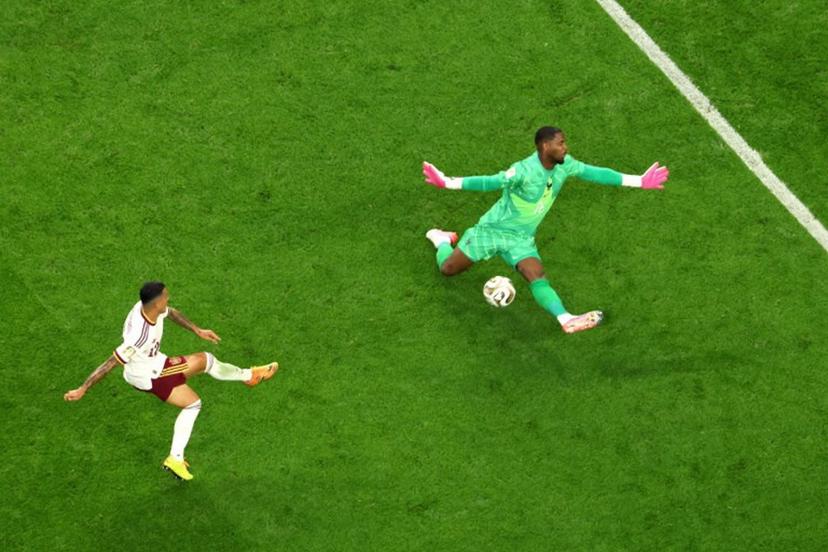Spain's defender #12 Pedro Porro scores his team's second goal past France's goalkeeper #16 Mike Maignan during the 2026 World Cup football tournament semi-final match between France and Spain at the Dallas Stadium in Arlington on July 14, 2026. Odd ANDERSEN / AFP