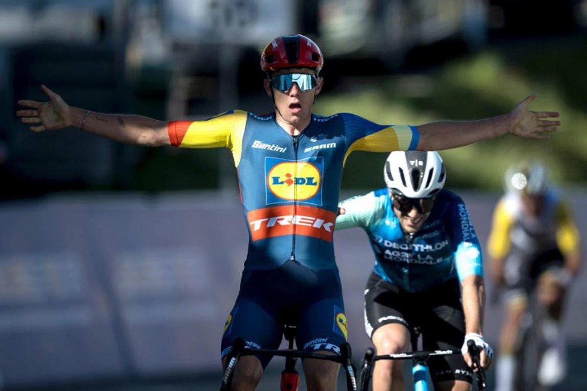 Team Lidl-Trek's Belgian rider Thibau Nys (L) celebrates as he crosses the finish line to win ahead of second placed team Decathlon AG2R La Mondiale's Italian Andrea Vendrame, during the second stage of the Tour of Romandy UCI cycling World tour 171 km from Fribourg to Salvan / Les Marecottes on April 25, 2024. Fabrice COFFRINI / AFP