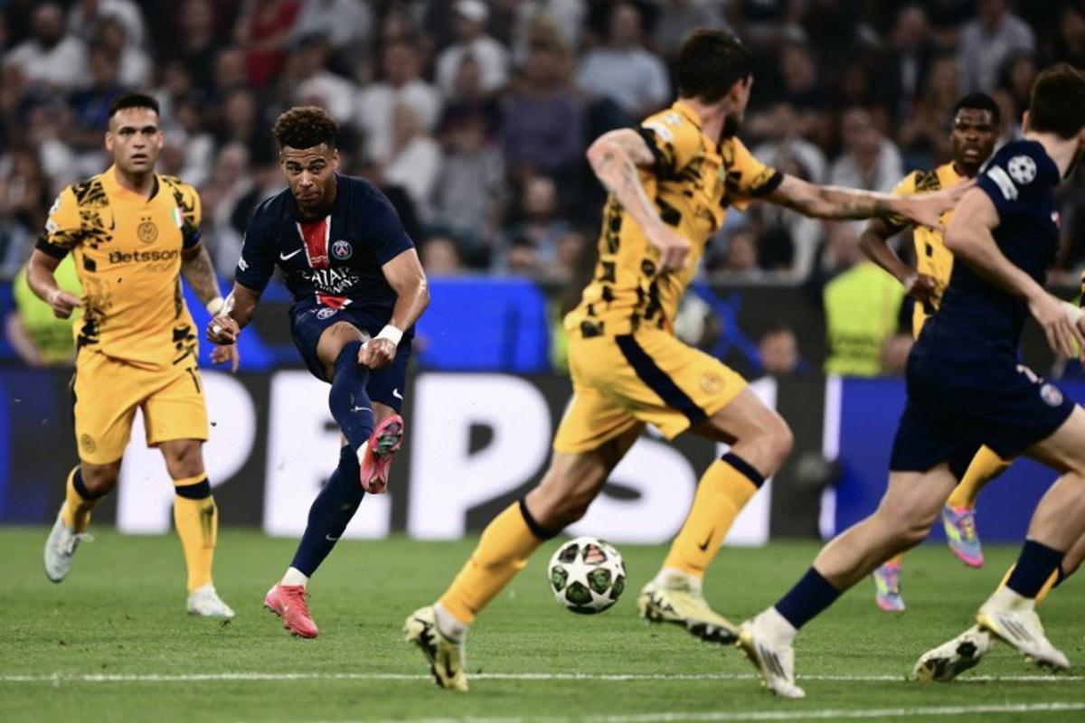 Paris Saint-Germain's French midfielder #14 Desire Doue shoots during the UEFA Champions League final football match between Paris Saint-Germain (PSG) and Inter Milan in Munich, southern Germany on May 31, 2025. Marco BERTORELLO / AFP