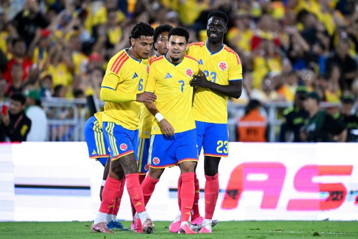 Colombia's forward #07 Luis Diaz celebrates with teammates midfielder #06 Richard Rios and defender #23 Davinson Sanchez after scoring their team's second goal during the international friendly football match between Colombia and Costa Rica at the Nemesio Camacho El Campin stadium in Bogota on June 1, 2026. Raul ARBOLEDA / AFP