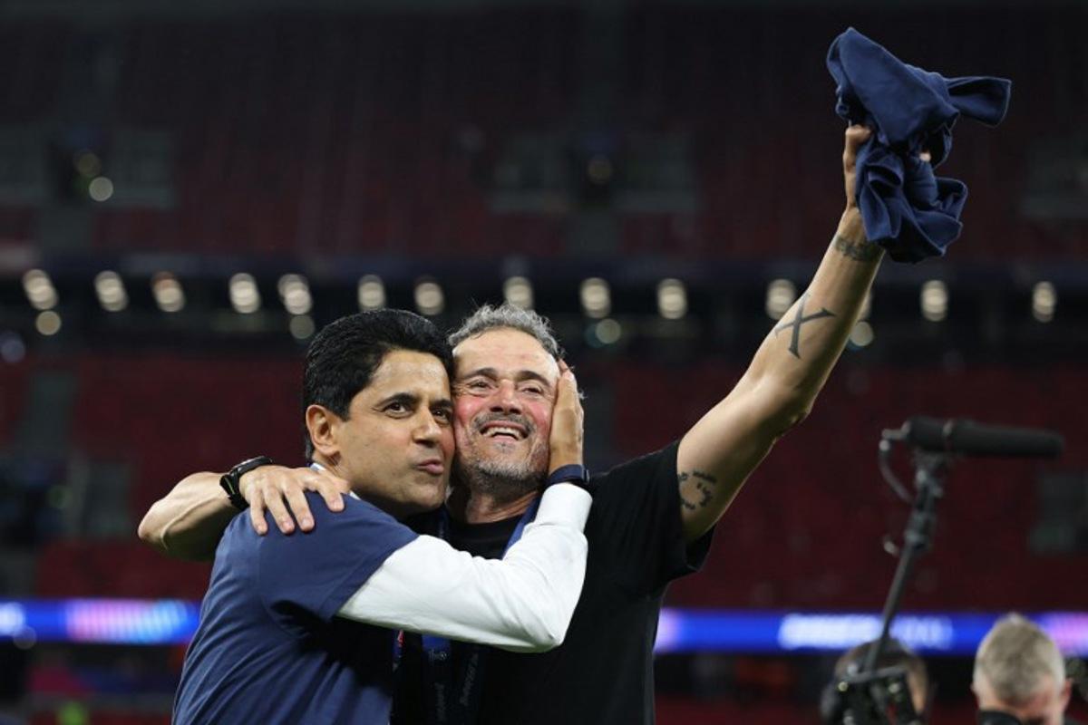 Paris Saint Germain's Qatari president Nasser al-Khelaifi (L) and Paris Saint-Germain's Spanish head coach Luis Enrique celebrate after winning the UEFA Champions League final football match between Paris Saint-Germain (PSG) and Arsenal FC at the Puskas Arena in Budapest on May 30, 2026. FRANCK FIFE / AFP
