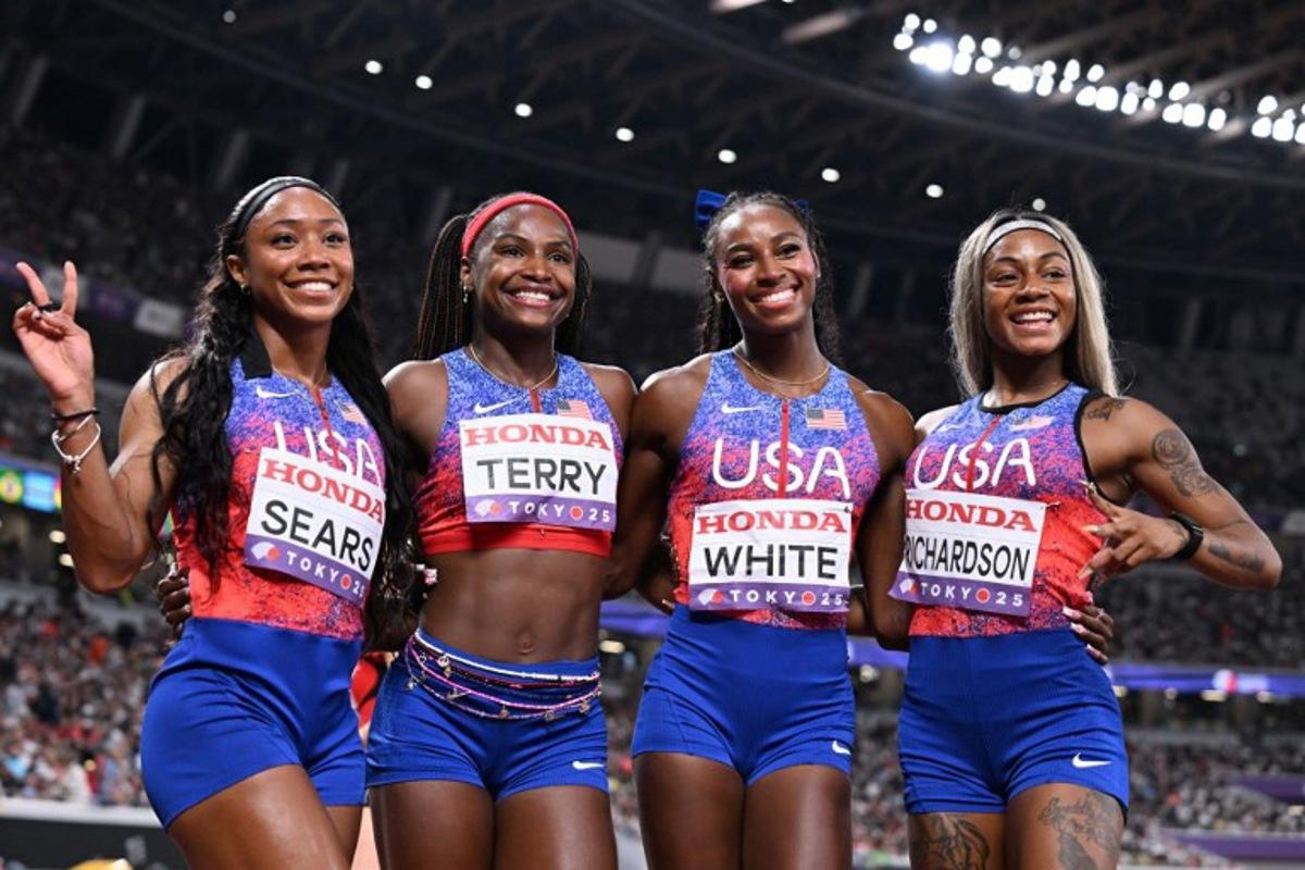 (From L) US' athlete Jacious Sears, US' Twanisha Terry, US' athlete Kayla White and US' Sha'carri Richardson pose after the women's 4x100m relay heats during the World Athletics Championships in Tokyo on September 20, 2025. Jewel SAMAD / AFP