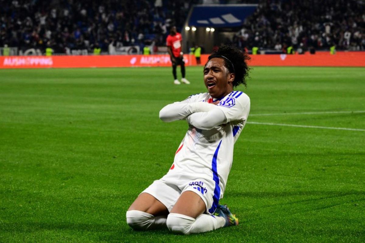 Lyon's Belgian forward #11 Malick Fofana celebrates after scoring his team's first goal during the French L1 football match between Olympique Lyonnais (OL) and Stade Rennais FC (Rennes) at The Groupama Stadium in Decines-Charpieu, central-eastern France on April 26, 2025. OLIVIER CHASSIGNOLE / AFP