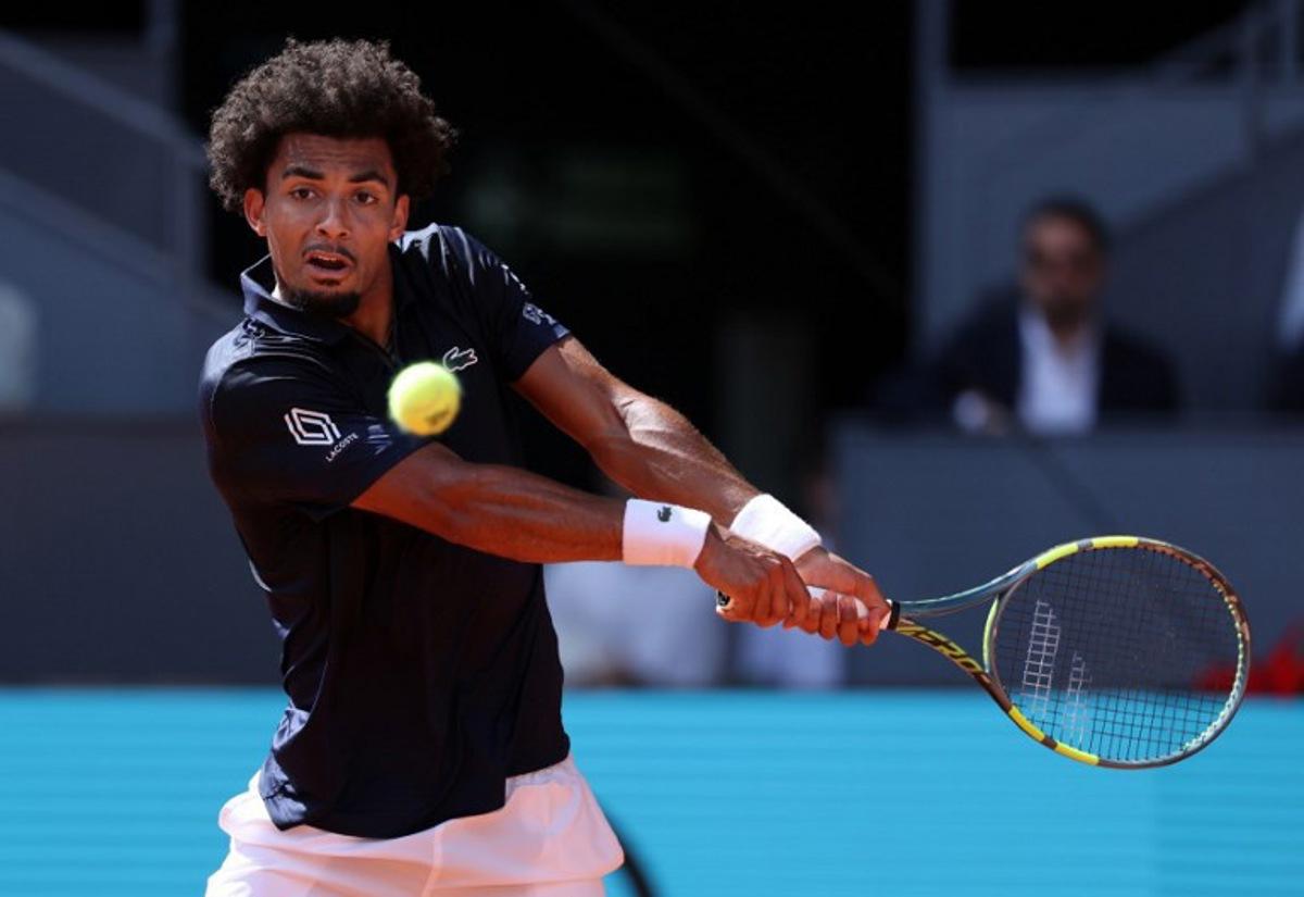 France's Arthur Fils returns the ball to Italy's Jannik Sinner during their 2026 ATP Tour Madrid Open tennis tournament semi-final singles match at the Caja Magica in Madrid, on May 1, 2026. Thomas COEX / AFP