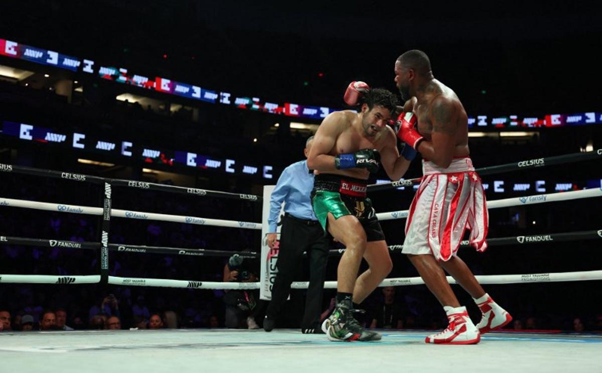 Cuban boxer Yuniel Dorticos (R) faces off against Mexican boxer Gilberto Ramírez during their WBA/WBO unified cruiserweight championship bout at the Honda Center in Anaheim, California, on June 28, 2025. Patrick T. Fallon / AFP