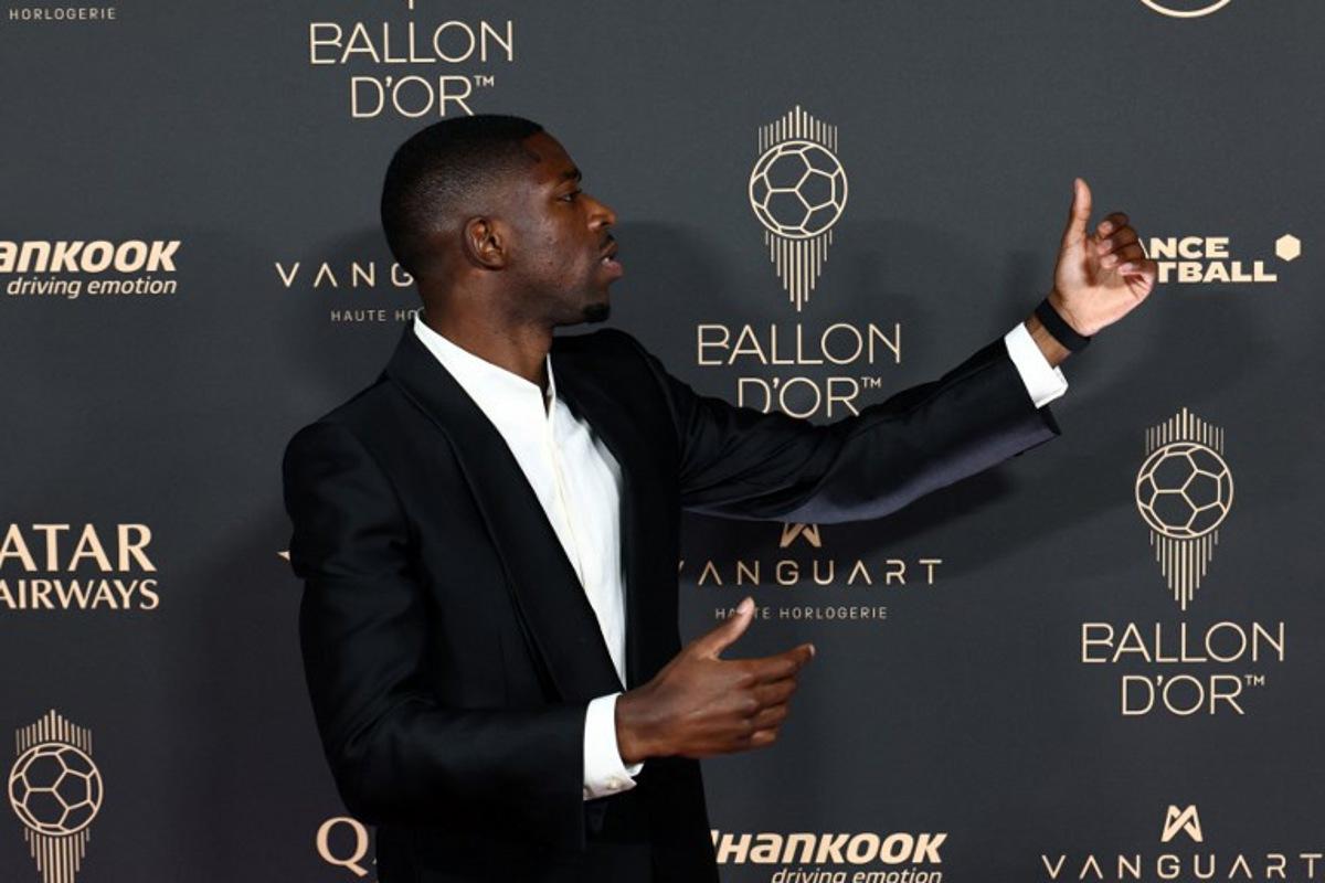 Paris Saint-Germain's French forward Ousmane Dembele poses upon arrival before the 2025 Ballon d'Or France Football award ceremony at the Theatre du Chatelet in Paris on September 22, 2025. FRANCK FIFE / AFP