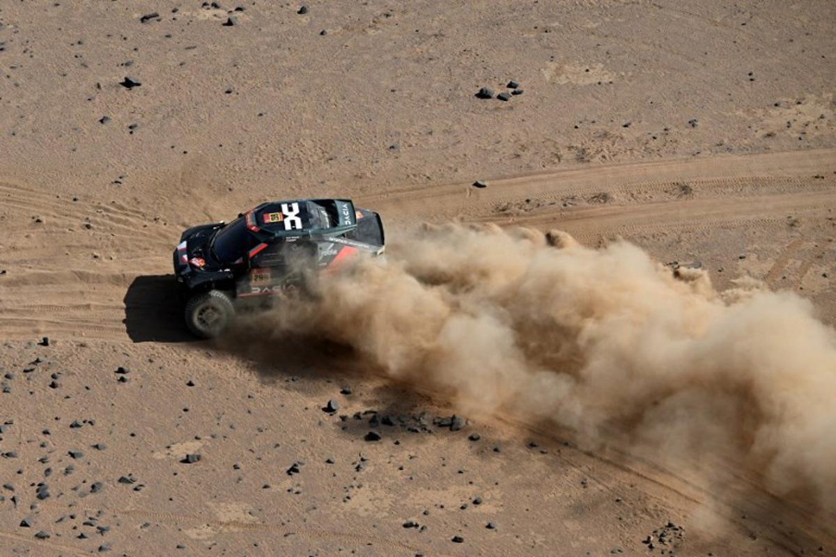The Dacia Sandriders's Qatari driver Nasser Al‑Attiyah and Belgian co‑pilot Fabian Lurquin compete in Stage 11 of the 48th edition of the Dakar Rally 2026, between Bisha and al-Henakiyah, Saudi Arabia, on January 15, 2026. Giuseppe CACACE / AFP