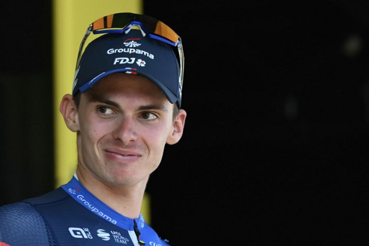 Groupama - FDJ team's French rider Romain Gregoire celebrates on the podium with the most combative rider's award after the 17th stage of the 111th edition of the Tour de France cycling race, 177,8 km between Saint-Paul-Trois-Chateaux and Superdevoluy, southern France, on July 17, 2024. Marco BERTORELLO / AFP