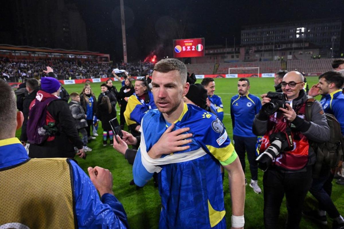 Bosnia-Herzegovina's forward #11 Edin Dzeko reacts after winning the FIFA World Cup 2026 European qualification final football match between Bosnia-Herzegovina and Italy at the Bilino-Polje stadium in Zenica on March 31, 2026. Elvis BARUKCIC / AFP