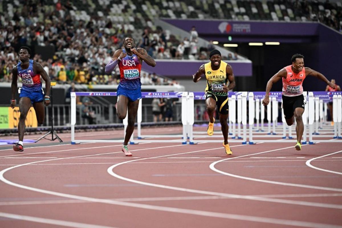 (L-R) US' athlete Ja'Kobe Tharp, US' athlete Cordell Tinch, Jamaica's Orlando Bennett and Japan's athlete Rachid Muratake cross the finish line in the men's 110m hurdles final during the World Athletics Championships in Tokyo on September 16, 2025. Jewel SAMAD / AFP