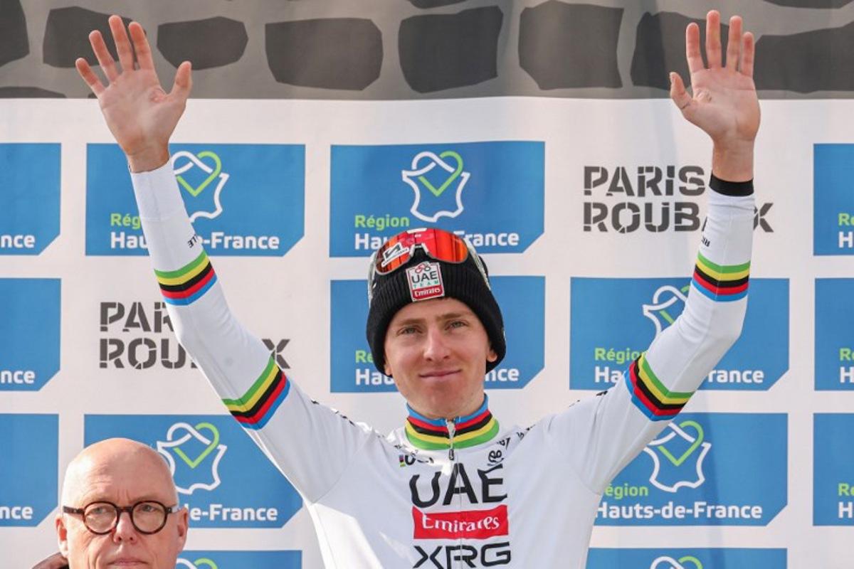 Second placed UAE Team Emirate's Slovenian rider Tadej Pogacar celebrates on the podium of the 122nd edition of the Paris-Roubaix one-day classic cycling race, 259,2 km between Compiegne and Roubaix, northern France on April 13, 2025. Francois LO PRESTI / AFP
