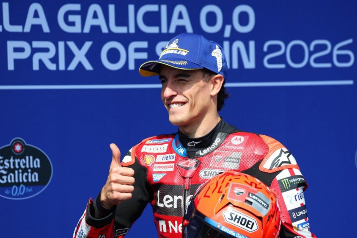 Ducati Lenovo Team's Marc Marquez celebrates getting the pole position after competing in the qualifying session of the MotoGP Spanish Grand Prix at the Jerez racetrack in Jerez de la Frontera, on April 25, 2026. Pierre-Philippe MARCOU / AFP