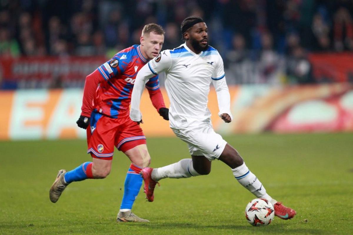 Viktoria Plzen's Czech forward #11 Matej Vydra (L) and Lazio's Portuguese defender #30 Nuno Tavares vie for the ball during the UEFA Europa League last 16, 1st leg football match FC Viktoria Plzen v SS Lazio in Plzen, Czech Republic, on March 6, 2025. MILAN KAMMERMAYER / AFP