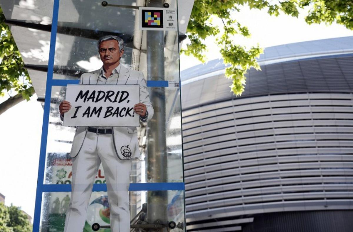 A mural by Italian urban artist Salvatore Benintende aka "TV BOY" depicting Portuguese coach Jose Mourinho is seen in front of the Santiago Bernabeu stadium in Madrid on May 21, 2026. Benfica coach Jose Mourinho confirmed on May 17, 2026 his agent Jorge Mendes has been in contact with Spanish giants Real Madrid. The veteran Portuguese coach, 63, has been strongly linked with a sensational return to the Santiago Bernabeu 13 years after he left Los Blancos. Mourinho said he personally has not had any contact with Madrid president Florentino Perez, or anyone else at the club, and that his future will be decided in the coming week. OSCAR DEL POZO / AFP