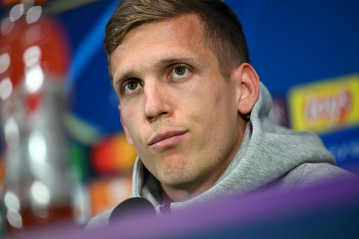 Barcelona's Spanish midfielder #20 Dani Olmo addresses a press conference, a day prior to the UEFA Champions League semi final second leg football match betweem Inter Milan and FC Barcelona, at the San Siro stadium in Milan on May 5, 2025. Piero CRUCIATTI / AFP