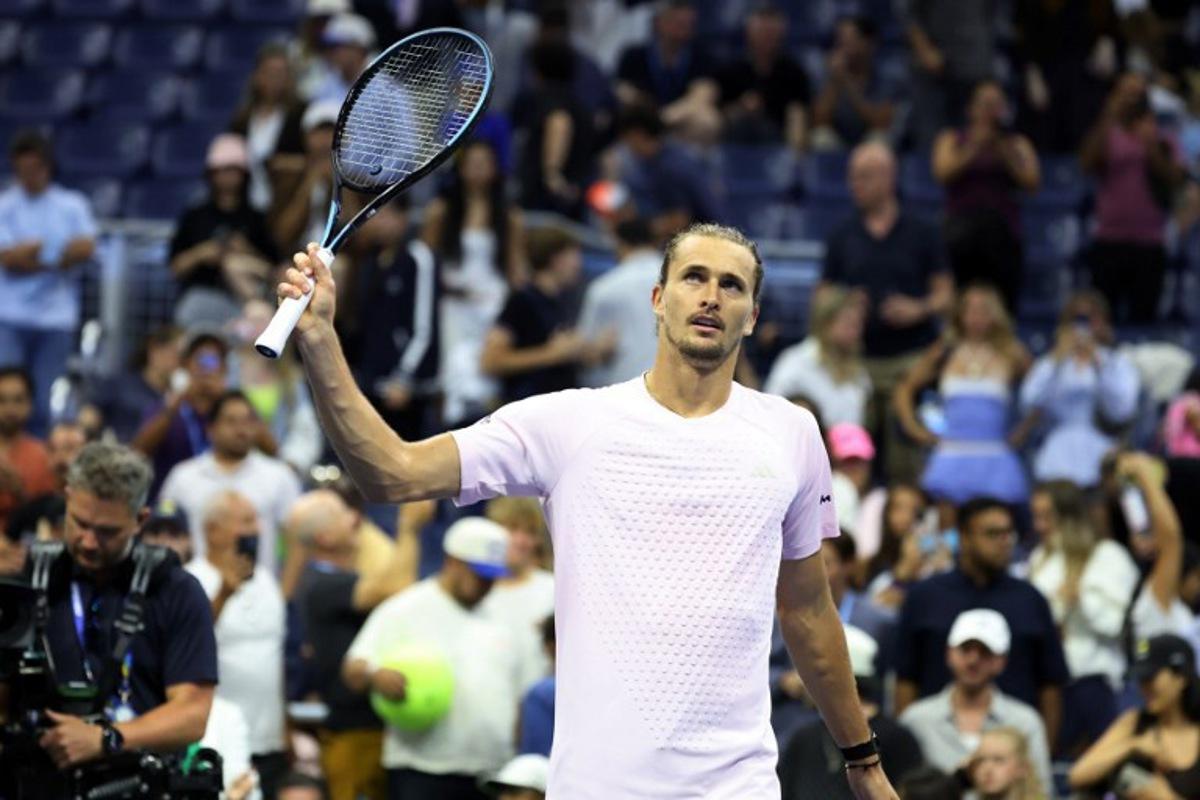Germany's Alexander Zverev waves his racquet to the crowd after defeating Chile's Alejandro Tabilo during their men's singles third-round tennis match on day seven of the US Open tennis tournament at the USTA Billie Jean King National Tennis Center in New York City in the early hours of September 6, 2026. Leonardo MUNOZ / AFP