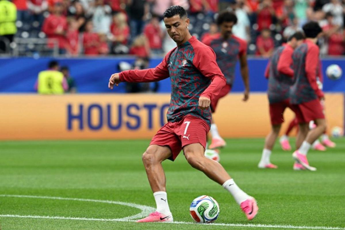 Portugal's forward #07 Cristiano Ronaldo warms up ahead of the 2026 World Cup Group K football match between Portugal and the Democratic Republic of Congo at the Houston Stadium in Houston on June 17, 2026. RONALDO SCHEMIDT / AFP
