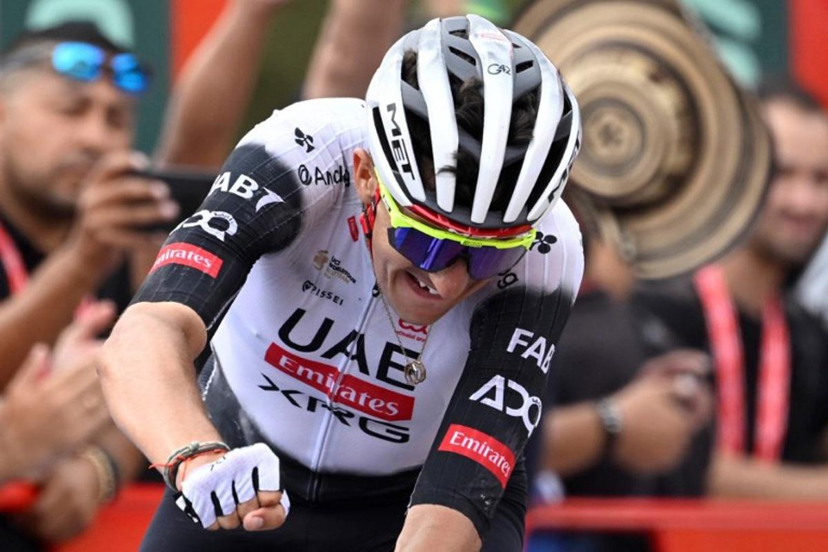 Team UAE's Spanish rider Marc Soler celebrates winning the 14th stage of the Vuelta a Espana cycling tour, a 135 km race between Aviles and La Farrapona in Somiedo, on September 6, 2025. Miguel RIOPA / AFP