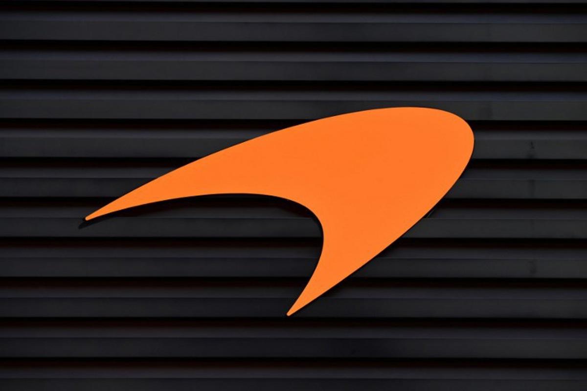 The logo for the Formula One McLaren Racing Team pictured at the Autodromo Internazionale Enzo e Dino Ferrari race track in Imola, Italy, on April 23, 2022, ahead of the Formula One Emilia Romagna Grand Prix. MIGUEL MEDINA / AFP